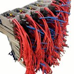 Pre-wired industrial electrical junction boxes with red and blue control wiring, custom cable assemblies for battery and industrial systems